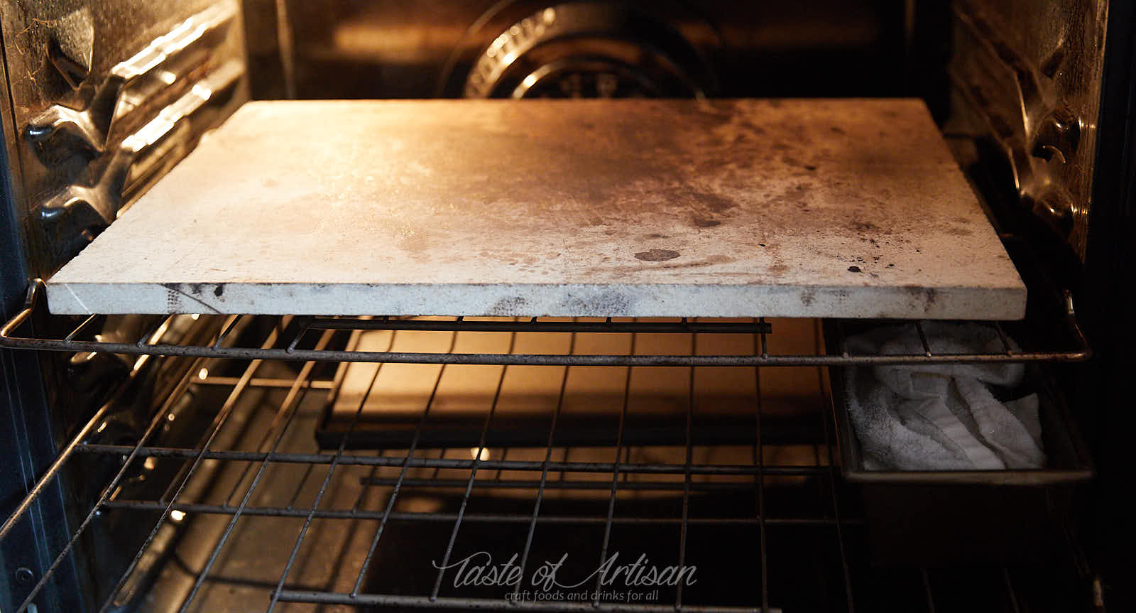 Baking stone and water pan preheating in the oven.