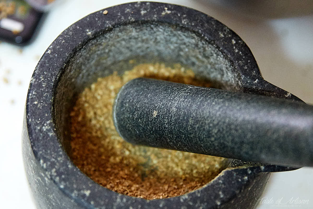 Summer sausage recipe. Grinding spices in a mortar.| Taste of Artisan