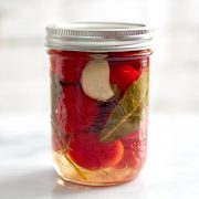 Pickled cherry peppers in a jar.