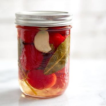 Cherry pepper pickled in a savory, with just a touch of sweetness, pickling liquid. These pickled cherry peppers are excellent with grilled and other meats. | Taste of Artisan