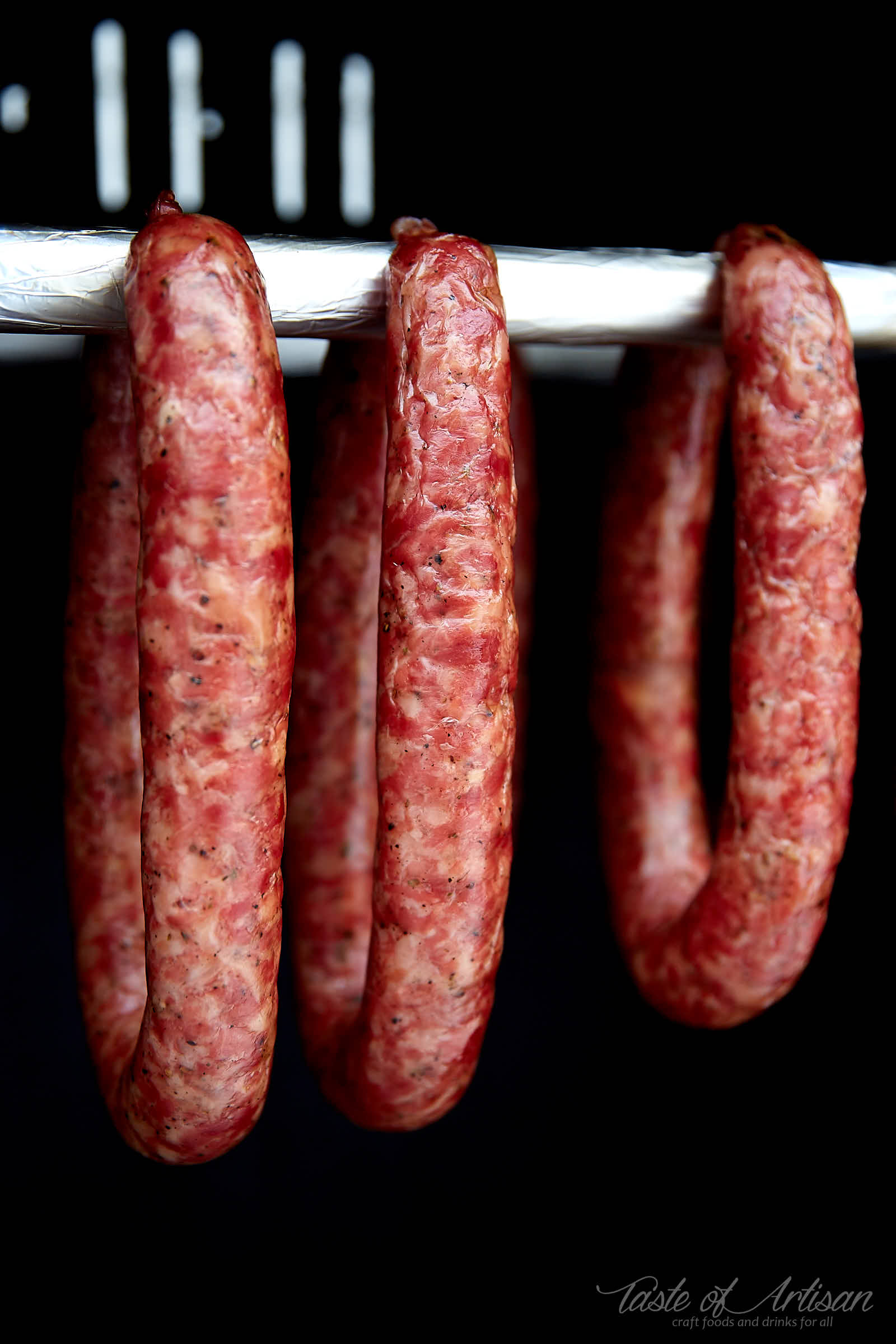 https://tasteofartisan.com/wp-content/uploads/2019/01/Swojska-Polish-Kielbasa-Sausage-inside-Smoker.jpg