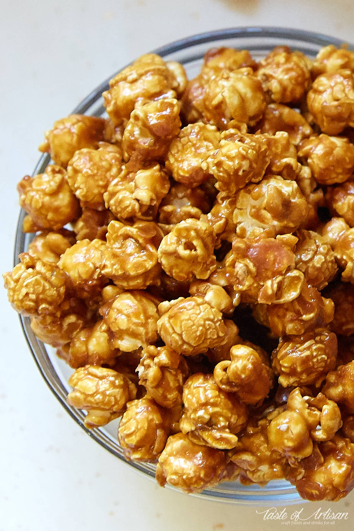 A bowl of homemade caramel popcorn, a top down view.