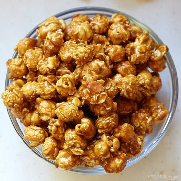 A bowl of homemade caramel popcorn, a top down view.