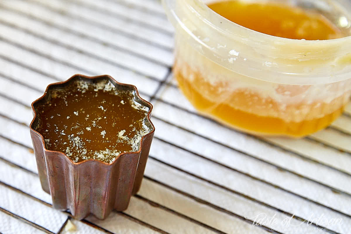 Canele mold coated with beeswax and butter mix.