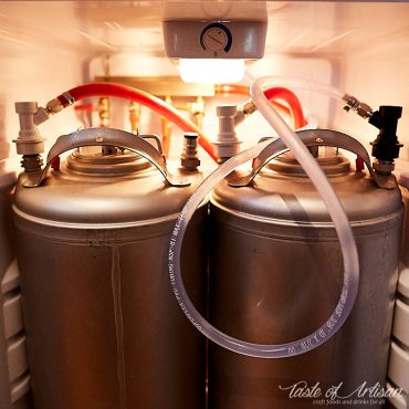 Two-keg kegerator setup that shows connections of kegs and CO2 lines.