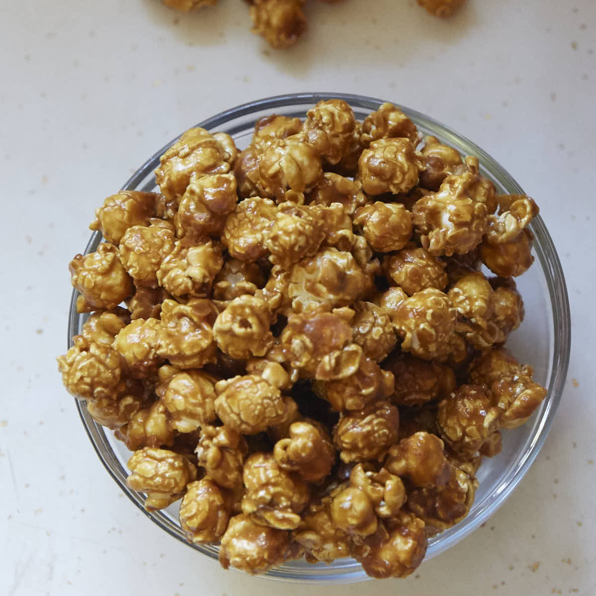 Caramel popcorn recipe that is so good and so easy that you will be making it over and over again. Warning: this caramel popcorn is very, very addictive.