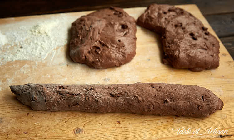 Chocolate baguette on a wooden board.