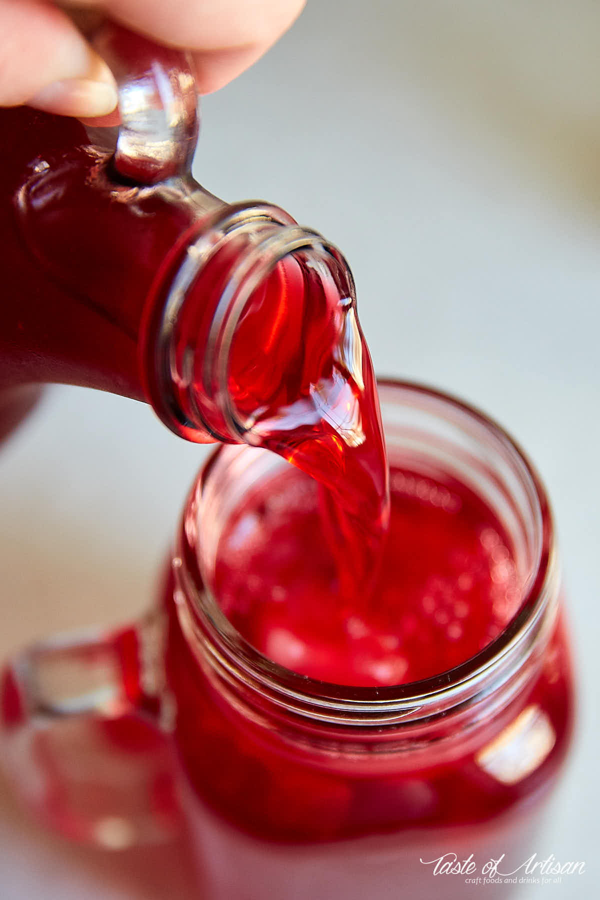 Mors drink being poured into a glass.