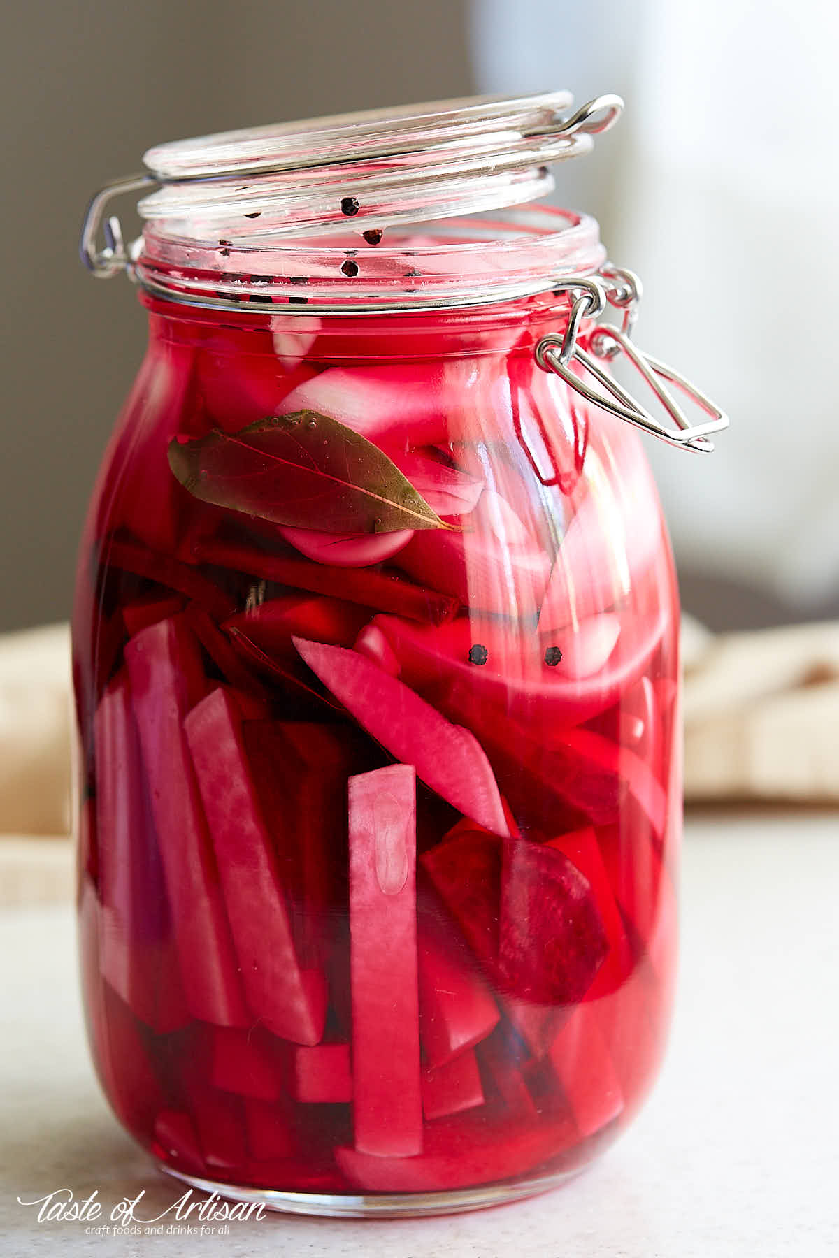 Pickled turnips inside a glass jar.