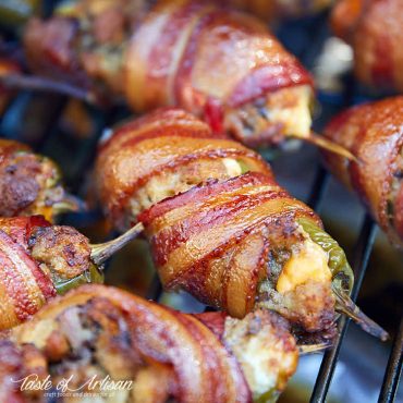Smoked jalapeno poppers, wrapped in bacon.