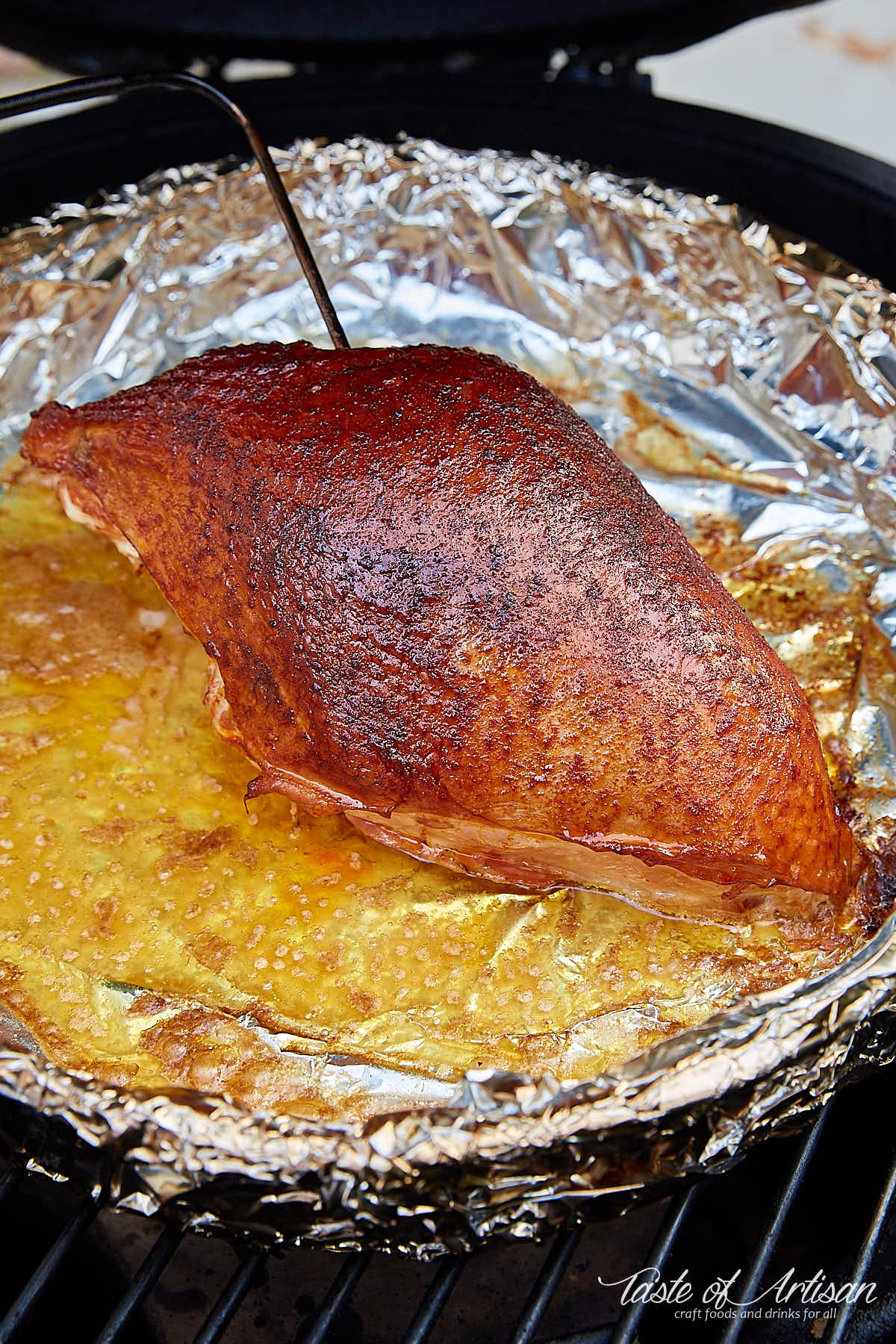 Smoked turkey breast inside smoker.