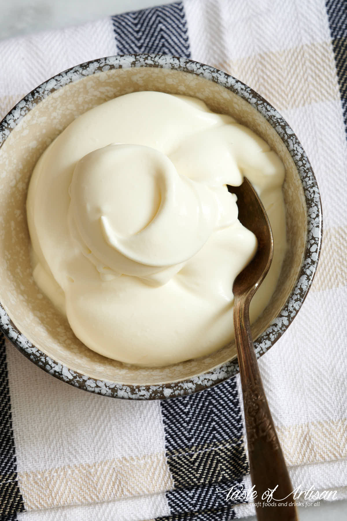 creme fraiche in a bowl with a spoon.