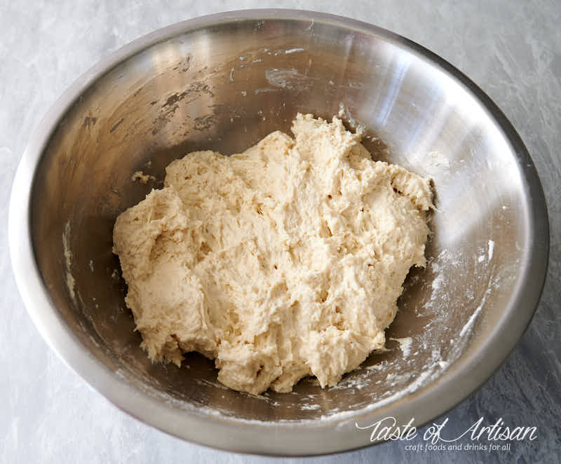 No knead bread ingredients mixed together in a bowl.