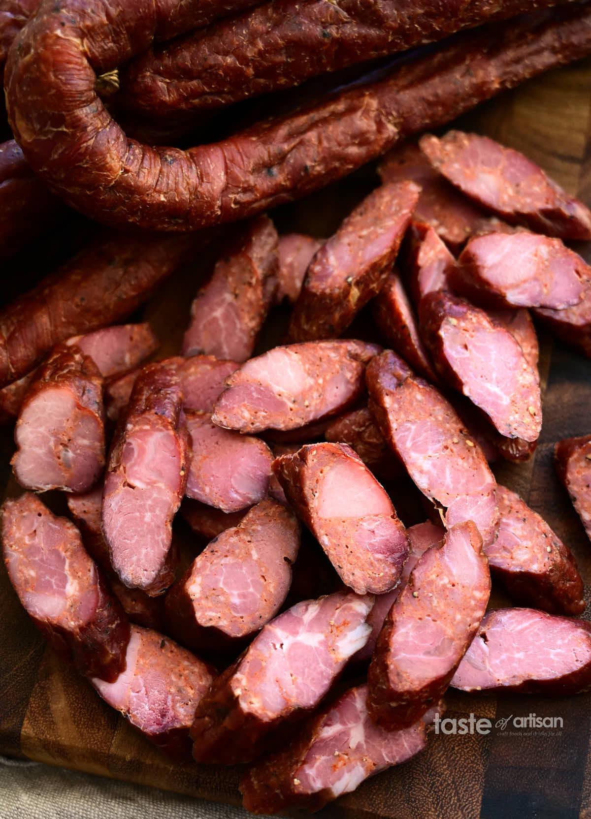 Homemade Andouille sausage amde with a combination of ground pork and chunks of meat, and flavored with just salt, pepper, cayenne and garlic.