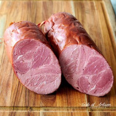 Close up of Krakow sausage cut in half.