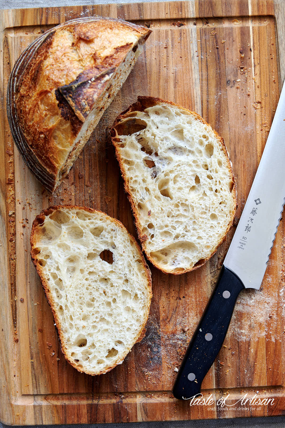 Sliced sourdough bread on a cutting board.