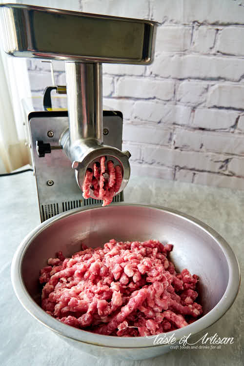 Grinding meat for Italian sausage using LEM meat grinder.