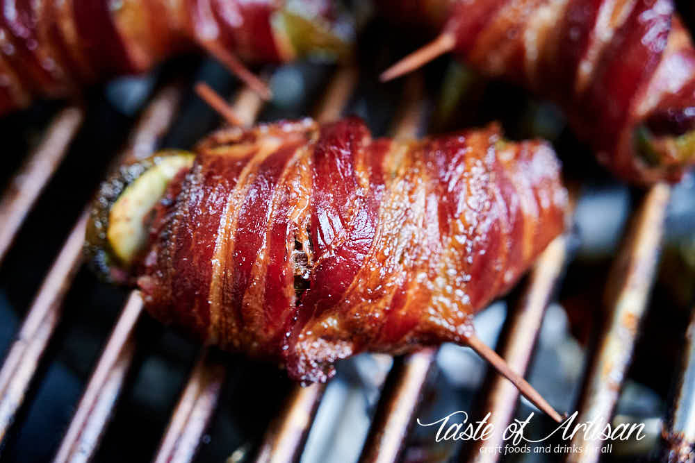 Close up of Texas twinkies - bacon wrapper jalapeno pepper stuffed with cream cheese and chopped brisket.