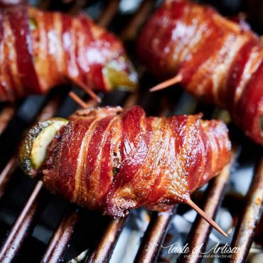 Close up of Texas twinkies - bacon wrapper jalapeno pepper stuffed with cream cheese and chopped brisket.