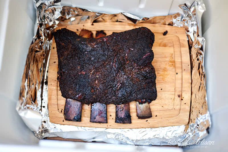 Smoked beef ribs in a faux Cambro.