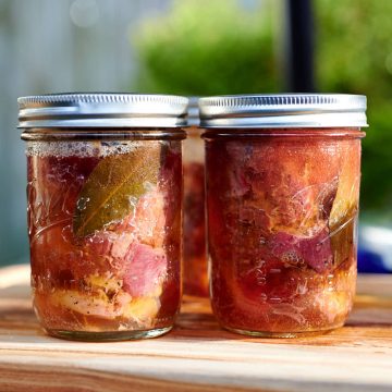 Cooked beef in mason jars.