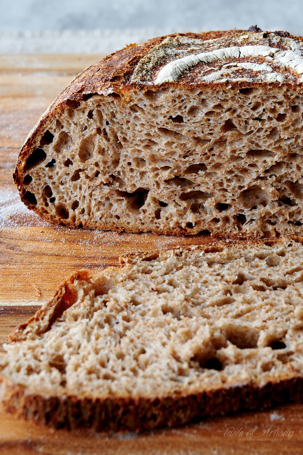 Sourdough bread cut in half, showing a nice open crumb.