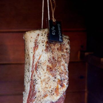 Guanciale in a smokehouse