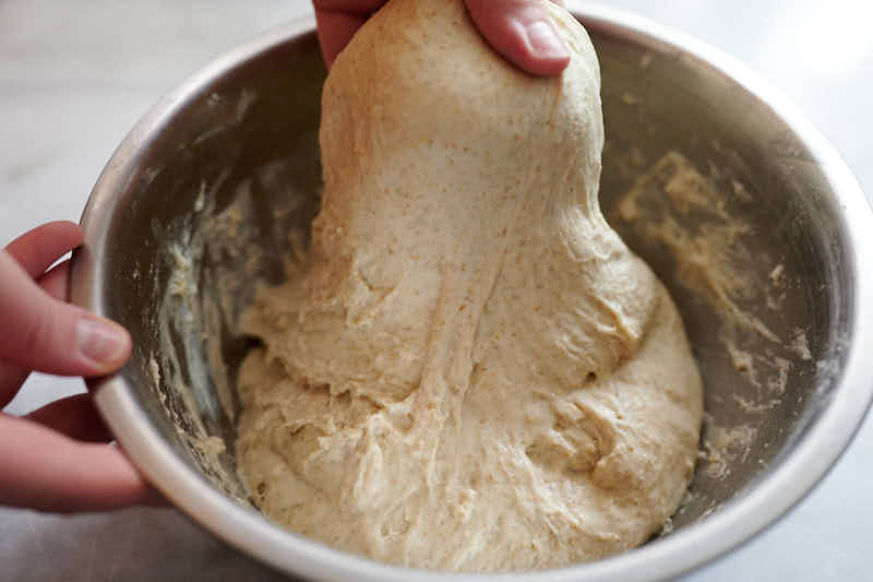 performing stretch and folds on the dough