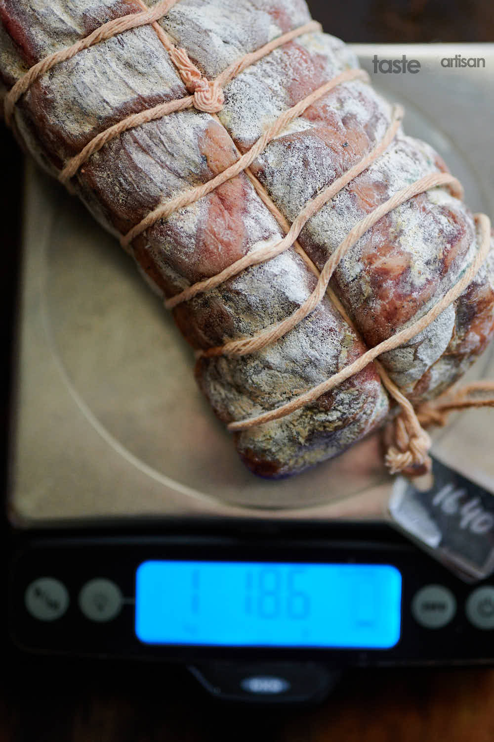 Weighing cured meat on a scale