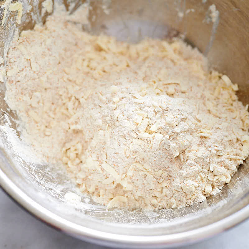 mixing butter and flour for biscuits