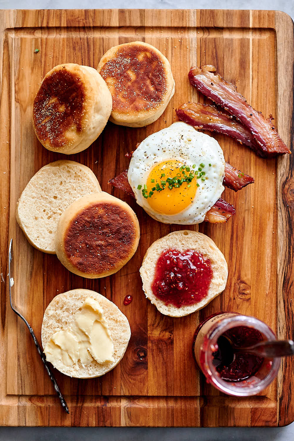 Sourdough English muffins with jam and butter