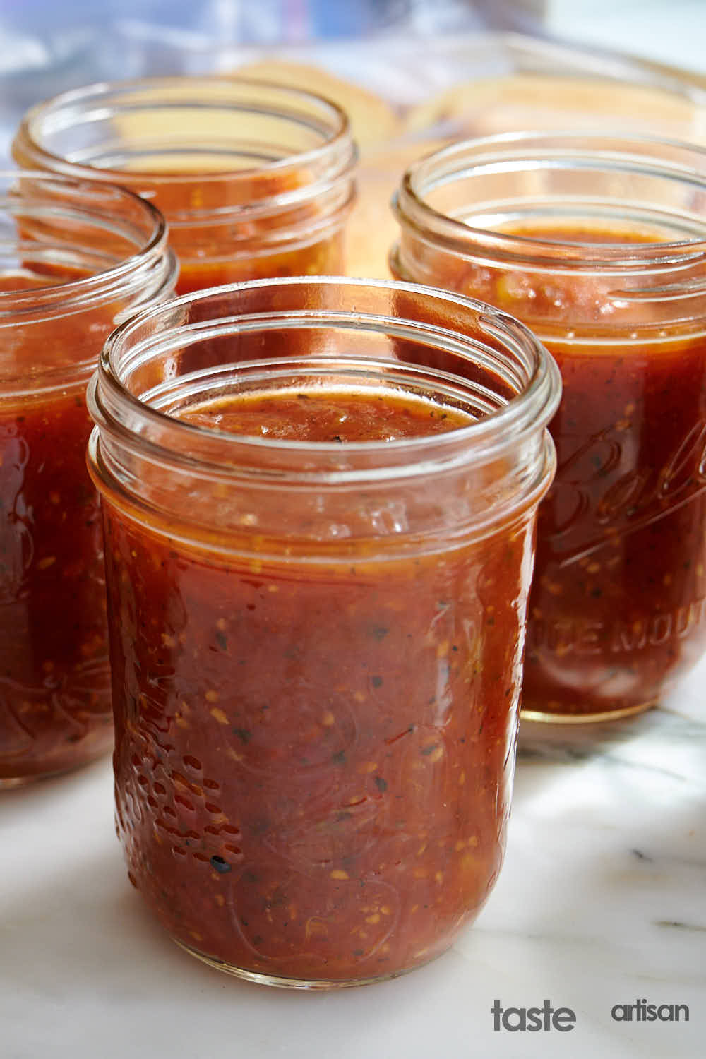 Homemade canned tomato sauce in jars.