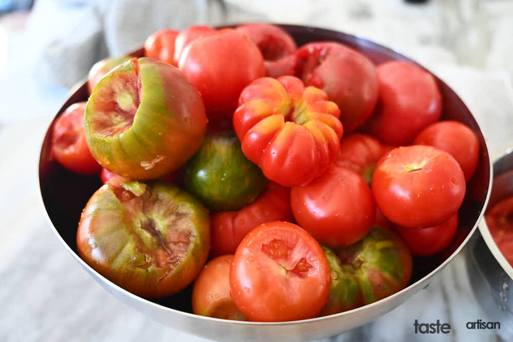 Cored tomatoes in a bowl.