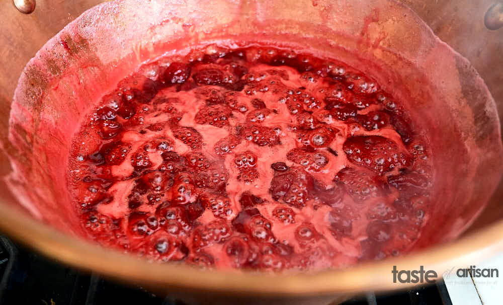 Strawberry Jam boiling in a jam pot.