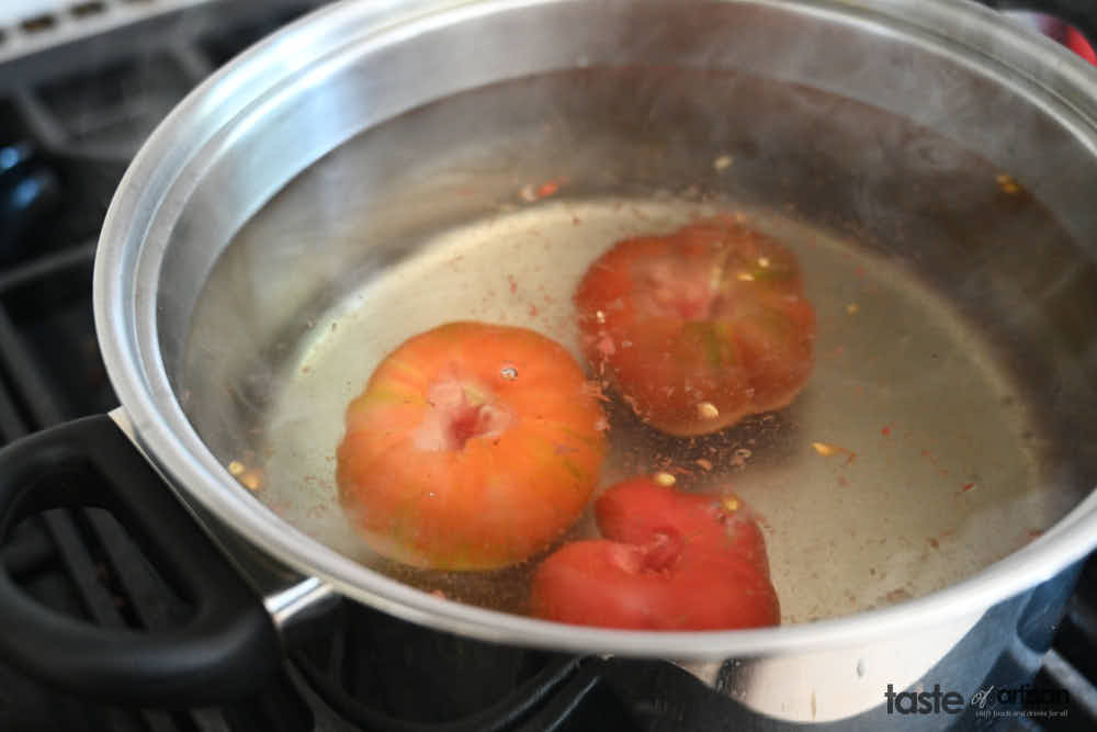 Blanching tomatoes.