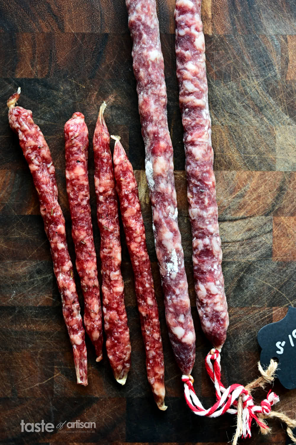 Comparing store-bought and homemade salami sticks.
