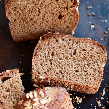 Beer bread loaf and slices on cutting board