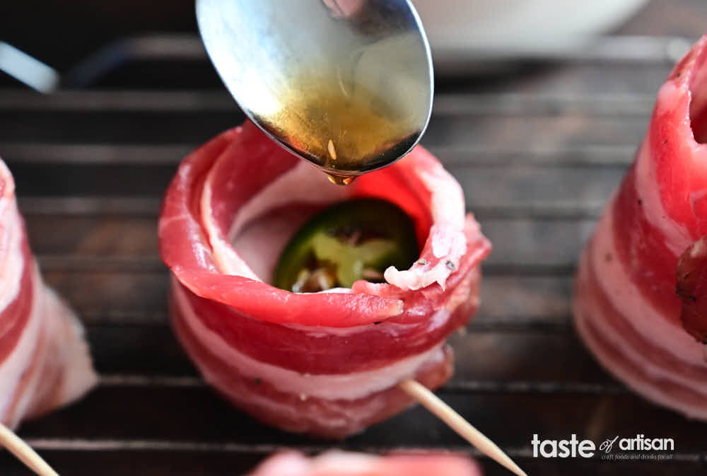 Adding a slice of jalapeno inside the pig shots and drizzling maple syrup.
