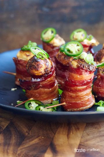 Pig shots, wrapped in crispy bacon, filled with delicious cream cheese filling and topped with BBQ rub and jalapeno slices.