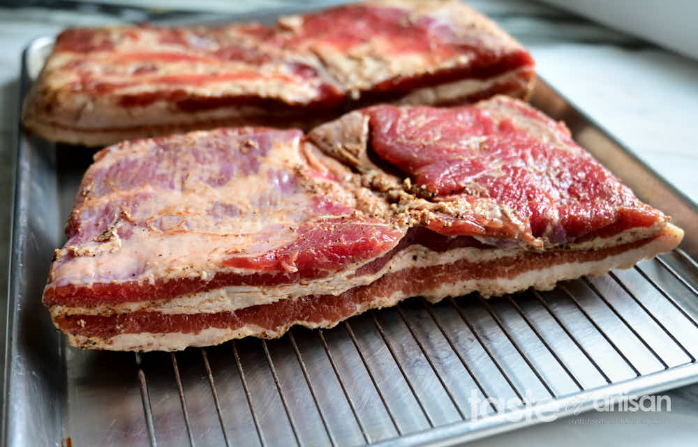 Drying cured bacon to create pellicle. 