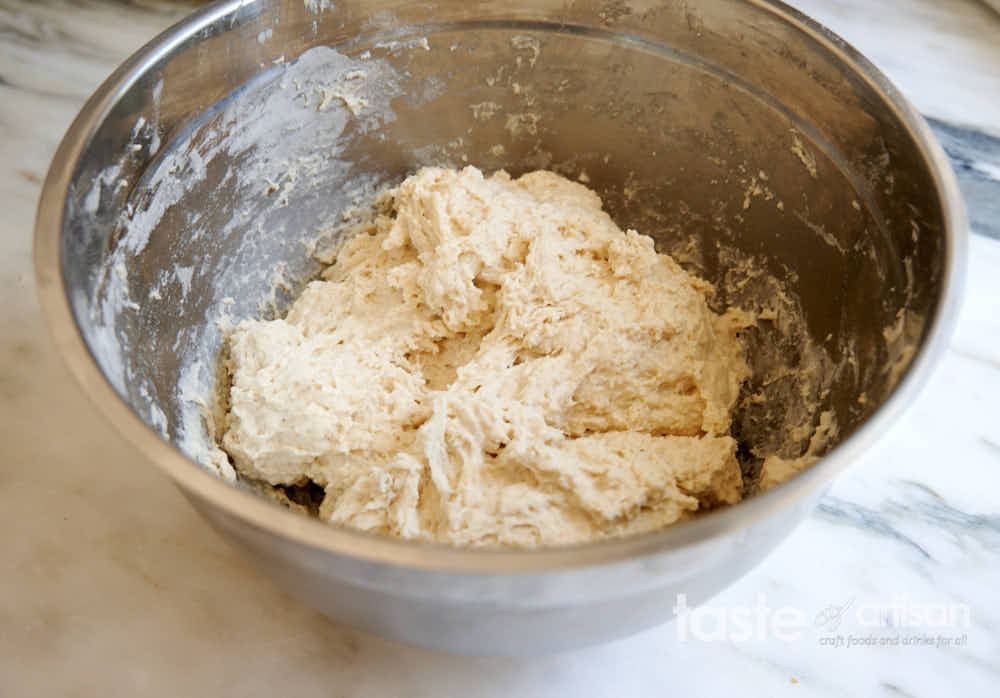 Pan bread dough in a bowl.