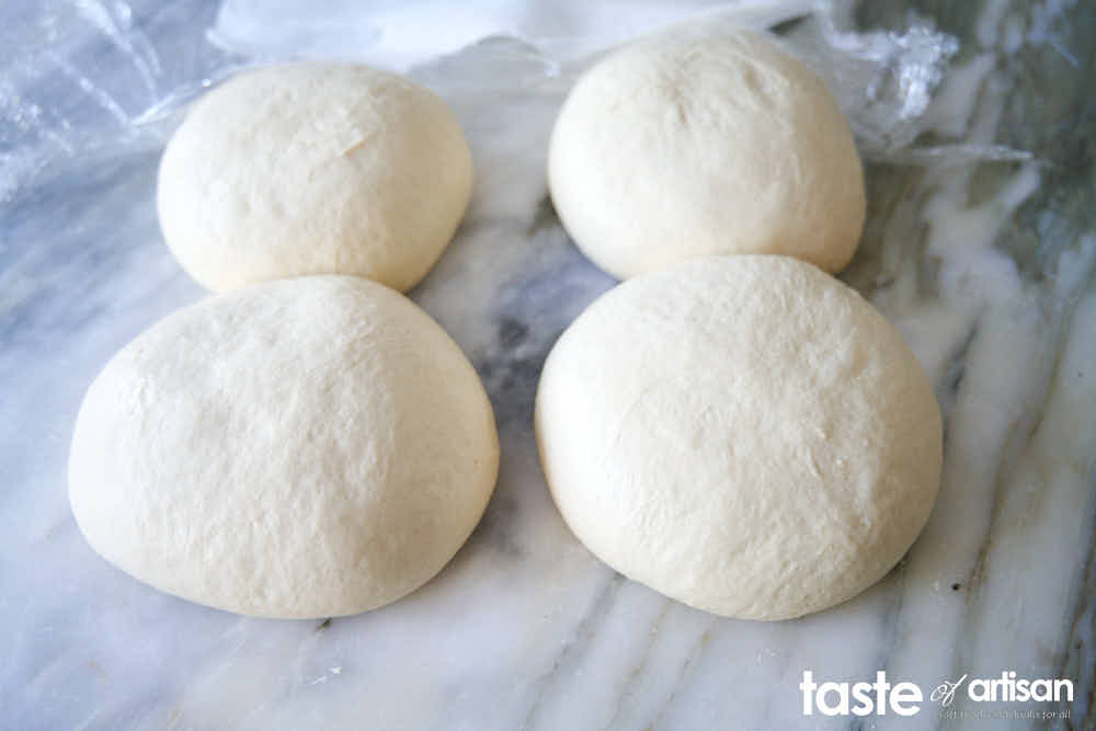 Pizza dough ball fully proofed.
