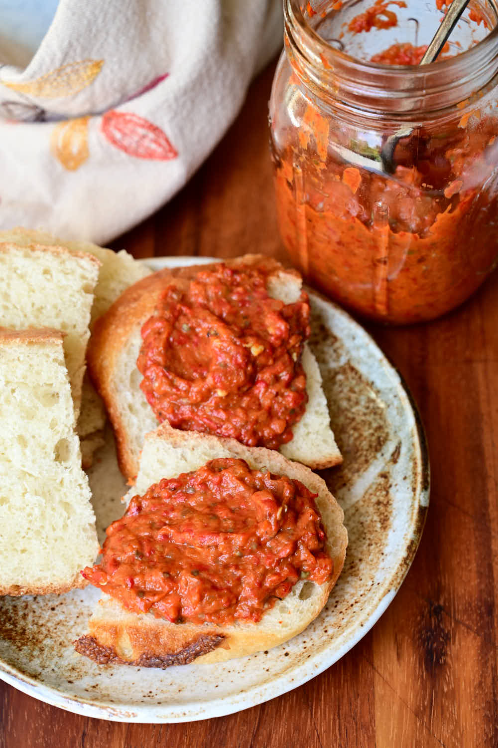Ajvar, made according to traditional ajvar recipe, served with slices of bread.