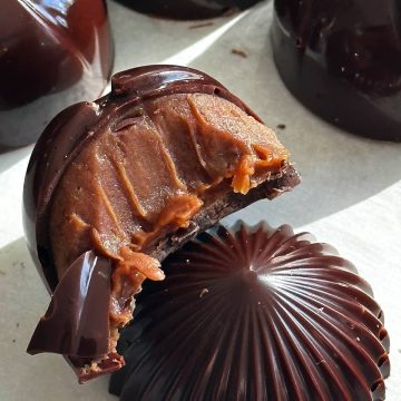 Chocolates made with pumpkin caramel ganache and dark chocolate shells.