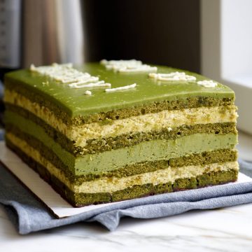 Matcha opera cake made with matcha sponge, pistachio buttercream and matcha ganache.