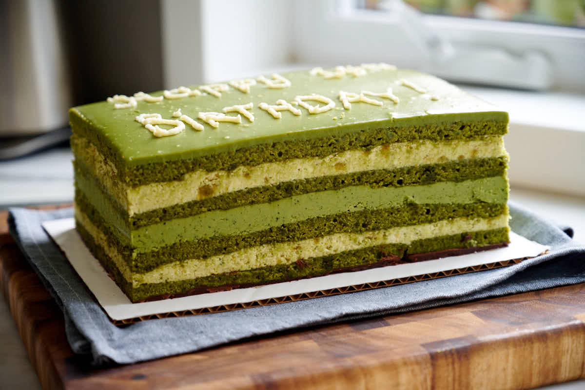 Birthday matcha and pistachio cake trimmed and ready to serve.
