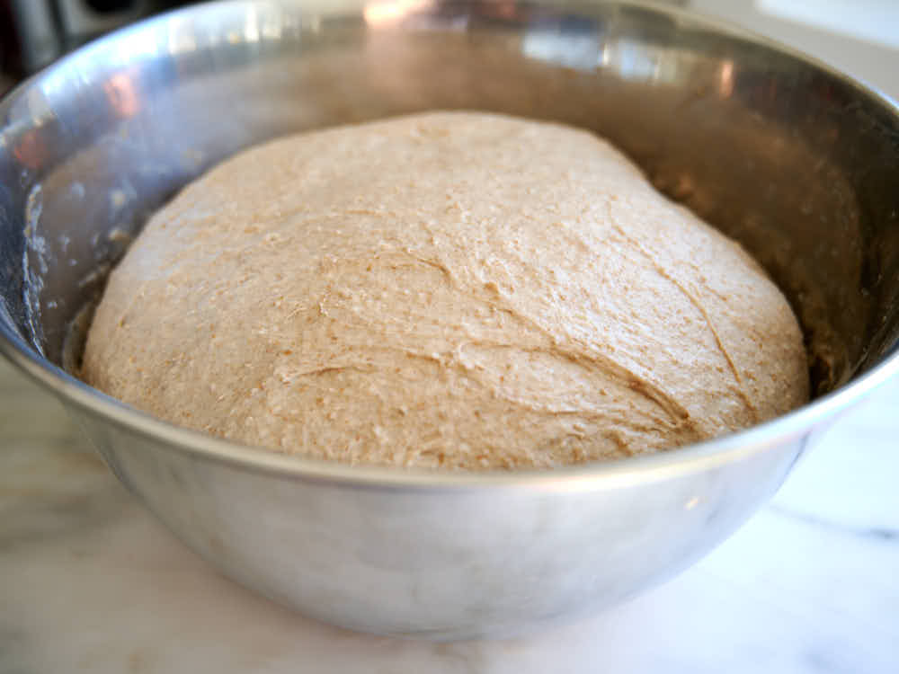 Rye bread dough in a bowl doubled in size.