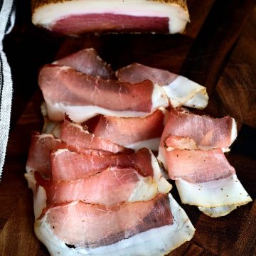 Karreespeck - Tyrolean Speck - Pork loin, seasoned with carefully selected spices and lightly smoked over beech wood, then dried-cured for 3 months to develop its fine and mild flavor.