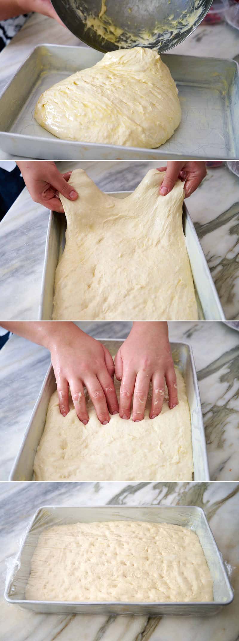 Stretching focaccia dough in pan.