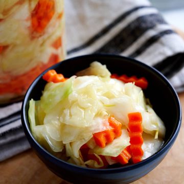Crunchy pickled cabbage. Made with a salty, sweet, and tangy brine and a little bit of sunflower oil. Very crunchy and addictively tasty. A perfect healthy side dish to grilled, BBQed and smoked meats.